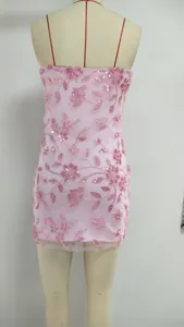 Detailed view of a pink sequin strapless bodycon mini dress on a mannequin