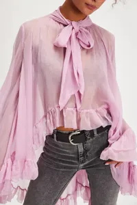 Detailed view of sheer lavender chiffon blouse with bow-tie neck and bell sleeves