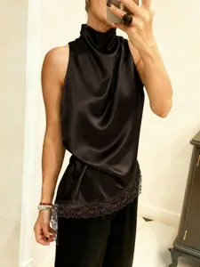 Detail view of a black satin halter neck top featuring an elegant asymmetrical lace hemline.