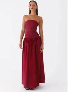 Detailed view of the dark red strapless long dress showcasing the elegant ruched waist design.