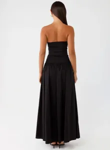 Detailed view showing the elegant back design of the black strapless pleated maxi dress.