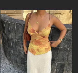 Yellow floral print camisole with V-neck and chic lettuce trim, stylish summer top.