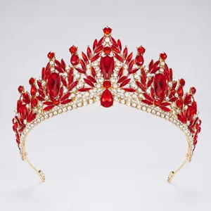 Baroque red crystal crown tiara detail shot showing exquisite gemstone cutting and golden metal base.