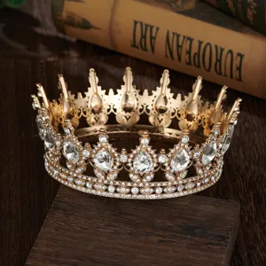 Baroque gold crystal crown detail, rhinestone pageant queen tiara close up view.
