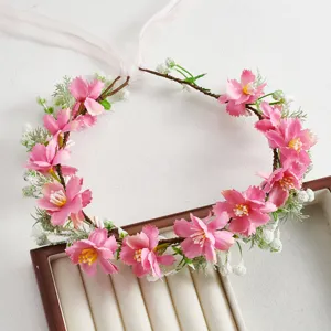 Pink bridal floral crown detail, forest style hair wreath with white ribbons for wedding and party.