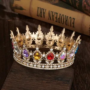 Close-up of Baroque crown detail with colorful teardrop gems and sparkling rhinestones.