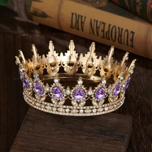 Baroque round crown bridal tiara with purple teardrop crystals and gold alloy finish.