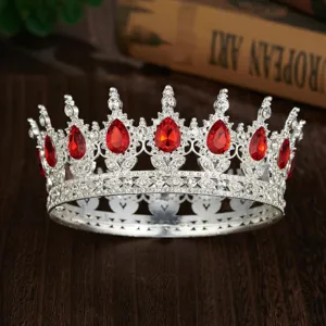 Baroque vintage red teardrop crystal round tiara queen crown detailed close-up shot.