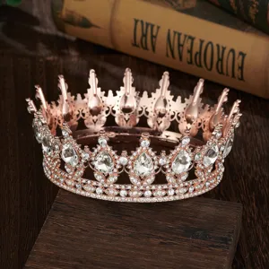 Close-up detail of rose gold baroque crystal tiara showing sparkling teardrop rhinestones.