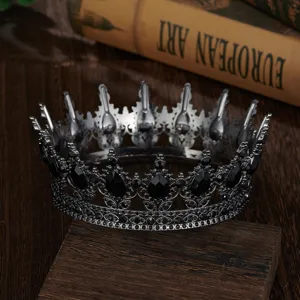 Black baroque crown detail shot, vintage metal tiara with sparkling rhinestones for wedding bride.