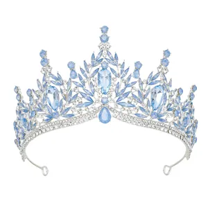 Exquisite silver bridal tiara crown featuring sparkling light blue crystals and clear rhinestones.
