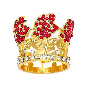 Gold alloy crown cake topper with red crystal clusters and sparkling clear rhinestones.