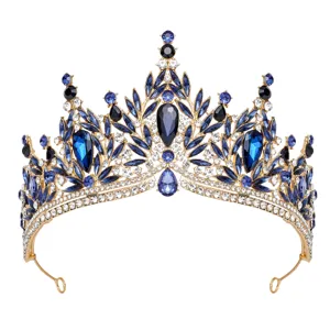 Stunning blue crystal tiara detail, featuring gold metal leaf pattern and sparkling rhinestones.