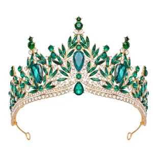 Detailed view of a stunning green crystal bridal tiara, sparkling gold crown for wedding.