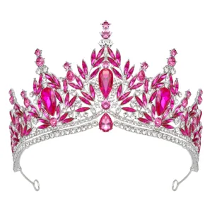 Close-up detail shot of the glittering pink crystal tiara, sparkling rhinestones on metal.