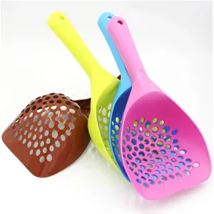 Detailed view of large thick plastic cat litter scoop with long handle and sifting holes.