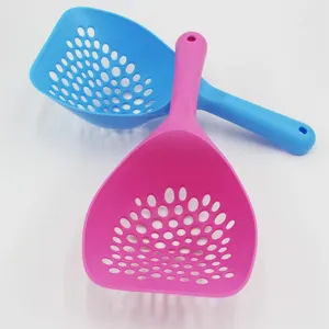Plastic cat litter scoop detail view, showing long handle and dense sifting holes design.