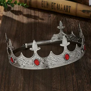 Detail view of European men silver crown with red gems for king costume party wedding event.