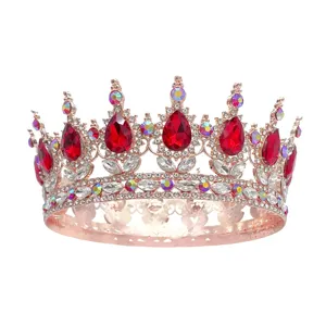 Couronne ronde baroque or rose avec cristaux en goutte rouge et strass étincelants.