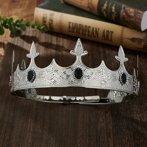 Close-up detail of vintage silver crown with black gems for men party performance props.