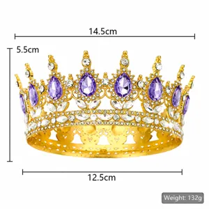 Detailed shot of luxury baroque golden crown with purple teardrop rhinestones and clear crystals.
