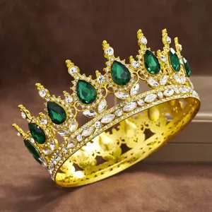 Exquisite baroque gold crown featuring stunning emerald green teardrop gems and sparkling rhinestones.