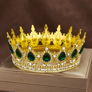 Baroque gold alloy crown detail shot, featuring green teardrop and clear rhinestones for hair accessories.