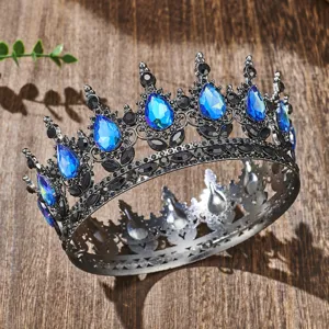 Close-up detail of the vintage baroque alloy crown featuring striking blue teardrop rhinestones.