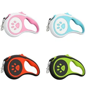 Durable retractable cat leash set in four vibrant colors featuring cute paw print design