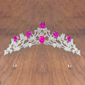 Kids crystal tiara crown detail shot, sparkling pink rhinestone princess hair hoop view.
