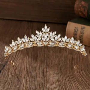 Exquisite gold alloy bridal tiara with sparkling crystal marquise rhinestones for wedding gown.