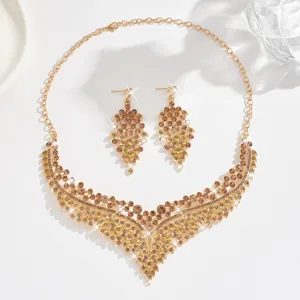 Chic gold-tone rhinestone necklace and earrings set, vintage statement crystal jewelry for women.