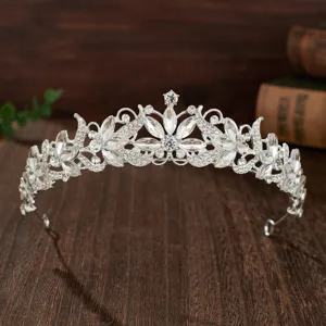 Detailed close-up of a sparkling crystal bridal tiara, silver metal wedding hair crown.