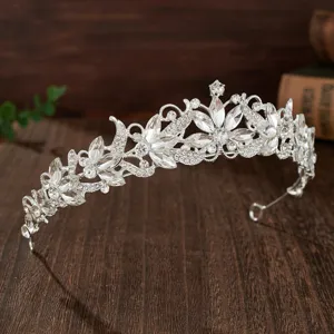Detailed view of silver crystal bridal tiara, sparkling rhinestone wedding hair accessory