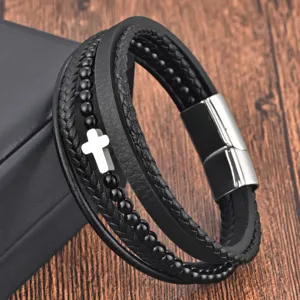 Stainless steel magnetic clasp detail of black leather braided multilayer men bracelet.