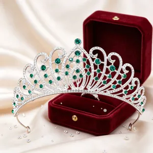 Exquisite silver tiara with green rhinestones for bridal wedding and party hair styling.