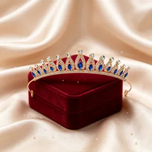 Stunning bridal crown tiara with blue and clear rhinestones for wedding and party hair styling.