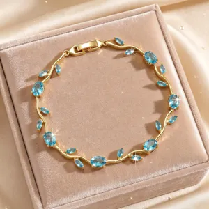 Gold-tone vine leaf bracelet sparkling blue zircon elegant jewelry delicate design accessory