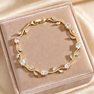 Gold leaf vine bracelet featuring sparkling cubic zirconia stones in exquisite detail design.