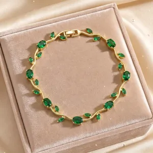 Close-up detail of the luxury green zircon vine bracelet, exquisite leaf design craftsmanship.