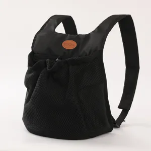 Breathable black mesh pet carrier backpack with leather detail for small dogs and cats