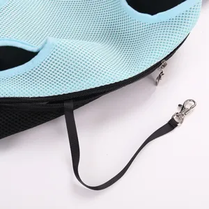 Close-up of pet chest backpack with breathable mesh fabric and safety hook detail