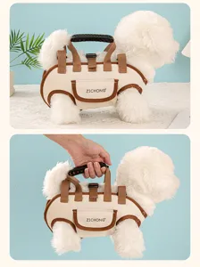 Detailed view of multifunctional cream pet carrier harness with handle shown being lifted