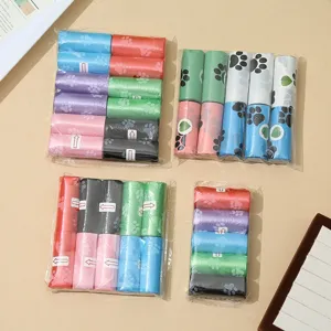 Detailed close-up view of colorful pet waste bags featuring cute paw print patterns in neat packs.