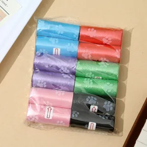 Colorful pet waste bags with cute paw prints, durable dog poop bags in rolls for easy clean up.