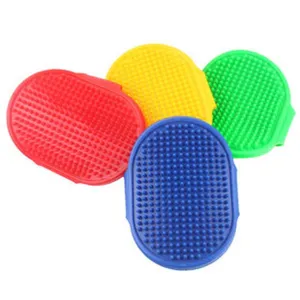 Silicone pet grooming brush set with soft rubber pins for gentle cat and dog massage.