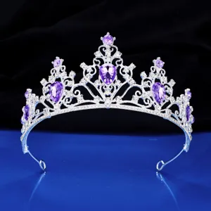 Exquisite silver bridal tiara close-up featuring stunning purple crystal rhinestones.