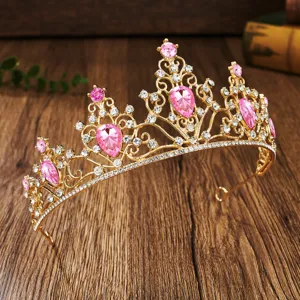 Elegant gold bridal tiara with sparkling pink crystals and clear rhinestones for wedding party.