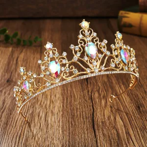 Close-up detail of a stunning gold bridal tiara sparkling with colorful rhinestones.