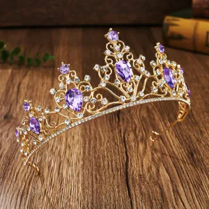 Exquisite gold tiara crown detailed with purple teardrop crystals and clear sparkling rhinestones.